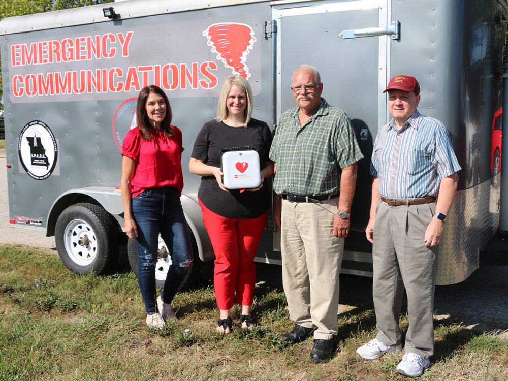 From left: Rhonda Ahern, Wear Red for Women committee member; Lauren Thiel-Payne, Bothwell Foundation executive director; Richard Camirand, SPARK vice president; and Harry Burford, SPARK secretary.